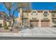 Inviting two-story home showcasing an attached two-car garage and manicured front yard at 7632 Amato Ave, Las Vegas, NV 89128