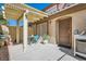 Private patio area with lattice roof and a table with chairs for outdoor enjoyment at 7632 Amato Ave, Las Vegas, NV 89128