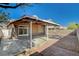 Charming backyard patio with cover, ideal for outdoor seating and relaxation with easy backyard access at 7719 Selby Ct, Las Vegas, NV 89147