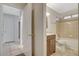 Bathroom featuring a shower-tub combo and vanity, viewed from the hallway at 7719 Selby Ct, Las Vegas, NV 89147