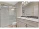 Bathroom with shower, single sink vanity, and tiled floors at 7719 Selby Ct, Las Vegas, NV 89147