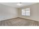 Spacious carpeted bedroom featuring a window with blinds at 7719 Selby Ct, Las Vegas, NV 89147