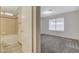 Bathroom with neutral tile and fixtures, accessed from the hallway and bedroom at 7719 Selby Ct, Las Vegas, NV 89147