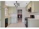 Bright kitchen with plentiful counter space, tile flooring, and modern, black appliances at 7719 Selby Ct, Las Vegas, NV 89147