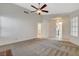 Bright living room with carpet, fireplace and a view of the entry and kitchen at 7719 Selby Ct, Las Vegas, NV 89147