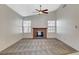 Cozy living room with a fireplace and windows for natural light at 7719 Selby Ct, Las Vegas, NV 89147