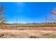 Well-maintained baseball field with green grass, red dirt, and clear blue sky. Perfect for sports enthusiasts and outdoor activities at 8745 Point Kathy Cir, Las Vegas, NV 89147