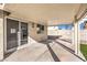 Covered patio with concrete flooring and access to the backyard at 8745 Point Kathy Cir, Las Vegas, NV 89147