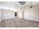 Bright living room featuring vaulted ceilings and modern light fixtures at 8745 Point Kathy Cir, Las Vegas, NV 89147