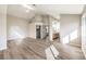 A spacious main bedroom featuring wood-look tile floors, a large closet and an attached bathroom at 8745 Point Kathy Cir, Las Vegas, NV 89147