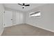 Calm bedroom with neutral carpet, ceiling fan, closet, and a window allowing natural light to fill the space at 905 Antelope Way, Las Vegas, NV 89145