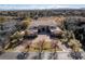 Luxury home on a tree-lined street featuring a circular paver driveway, and meticulous landscaping at 9631 Orient Express Ct, Las Vegas, NV 89145