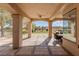 Covered patio featuring an outdoor dining set and a view of the large manicured lawn and community beyond at 9631 Orient Express Ct, Las Vegas, NV 89145