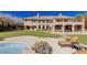 Lounge area with a beautiful pool and a sprawling backyard, perfect for entertaining and relaxation at 9631 Orient Express Ct, Las Vegas, NV 89145