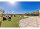 Backyard with a cozy seating area and view of pool and landscape, an ideal setting for outdoor enjoyment at 9631 Orient Express Ct, Las Vegas, NV 89145