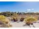 Inviting backyard lounge area with comfortable seating, set against a desert backdrop ideal for relaxation and conversation at 9631 Orient Express Ct, Las Vegas, NV 89145