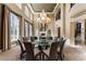 Spacious dining area with a large table, modern lighting, and seamless transition to other living areas at 9631 Orient Express Ct, Las Vegas, NV 89145