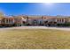 Expansive home showcasing a circular driveway, lush lawn, and classic architecture, creating a grand entrance at 9631 Orient Express Ct, Las Vegas, NV 89145