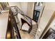 Grand foyer with a staircase, a white piano, and an elegant chandelier at 9631 Orient Express Ct, Las Vegas, NV 89145