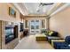 Stylish living room features a fireplace, balcony doors, and built in cabinets at 9631 Orient Express Ct, Las Vegas, NV 89145