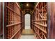 Elegant wine cellar with ample wooden racks for wine storage at 9631 Orient Express Ct, Las Vegas, NV 89145