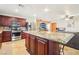 Spacious kitchen with an island, granite countertops, and stainless steel appliances at 1011 Amber Gate St, Henderson, NV 89002