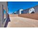 Expansive backyard surrounded by brick wall, perfect for creating your dream outdoor oasis at 10246 Bloom Quick Ct, Las Vegas, NV 89141