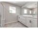Bathroom featuring double sink vanity, tile flooring, and glass enclosed shower at 10246 Bloom Quick Ct, Las Vegas, NV 89141