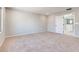 Open bedroom area featuring neutral carpet and light-colored walls at 10246 Bloom Quick Ct, Las Vegas, NV 89141