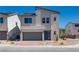 Charming two-story home with a two-car garage and a well-manicured front yard, perfect for suburban living at 10246 Bloom Quick Ct, Las Vegas, NV 89141