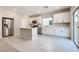 Modern kitchen with stainless steel appliances, a center island, and access to the backyard at 10246 Bloom Quick Ct, Las Vegas, NV 89141