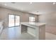 Bright kitchen featuring white counter tops and stainless steel appliances near the sliding glass door at 10246 Bloom Quick Ct, Las Vegas, NV 89141