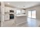 Bright kitchen featuring recessed lighting, white cabinets, and stainless steel appliances at 10246 Bloom Quick Ct, Las Vegas, NV 89141