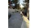 Spacious backyard featuring a concrete patio and gated entryway at 10321 Birch Bluff Ln, Las Vegas, NV 89145