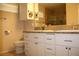 Bathroom featuring double sinks, granite countertops and modern cabinetry at 10321 Birch Bluff Ln, Las Vegas, NV 89145