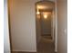 Arched hallway features neutral paint and carpeting at 10321 Birch Bluff Ln, Las Vegas, NV 89145