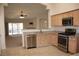 Well-lit kitchen features granite counters, stainless steel appliances, and ample cabinetry at 10321 Birch Bluff Ln, Las Vegas, NV 89145