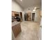 Spacious kitchen featuring stainless steel appliances, tile flooring, and ample cabinet space at 10321 Birch Bluff Ln, Las Vegas, NV 89145