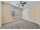 Comfortable bedroom with neutral carpet, window with blinds, and closet for storage at 10332 Sweet Laurel St, Las Vegas, NV 89178