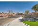 Welcoming Mirasol community entrance with stone signage and landscaped surroundings on a sunny day at 10332 Sweet Laurel St, Las Vegas, NV 89178