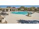 Sparkling community pool with lounge chairs, shaded seating areas, and well-maintained surroundings at 10332 Sweet Laurel St, Las Vegas, NV 89178