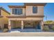Exterior facade featuring an attached two-car garage at 10332 Sweet Laurel St, Las Vegas, NV 89178