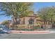 Inviting corner lot home featuring a manicured yard with mature trees and charming street sign at 10332 Sweet Laurel St, Las Vegas, NV 89178