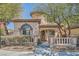 Charming single story home featuring well manicured front yard and a stone tower detail at 10332 Sweet Laurel St, Las Vegas, NV 89178