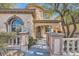 Stunning property featuring a stone facade, arched window and well maintained yard at 10332 Sweet Laurel St, Las Vegas, NV 89178