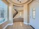 Elegant foyer boasts tile flooring, a decorative archway and view of the staircase at 10332 Sweet Laurel St, Las Vegas, NV 89178