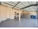 Spacious garage with epoxy flooring, shelving and direct access to the house at 10332 Sweet Laurel St, Las Vegas, NV 89178