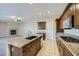 Open kitchen with granite countertops, stainless steel appliances, and a large island at 10332 Sweet Laurel St, Las Vegas, NV 89178