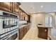 Gourmet kitchen boasting stainless appliances, granite counters, and large breakfast bar at 10332 Sweet Laurel St, Las Vegas, NV 89178