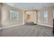 Open loft area with multiple windows, carpet flooring, and a landing at 10332 Sweet Laurel St, Las Vegas, NV 89178